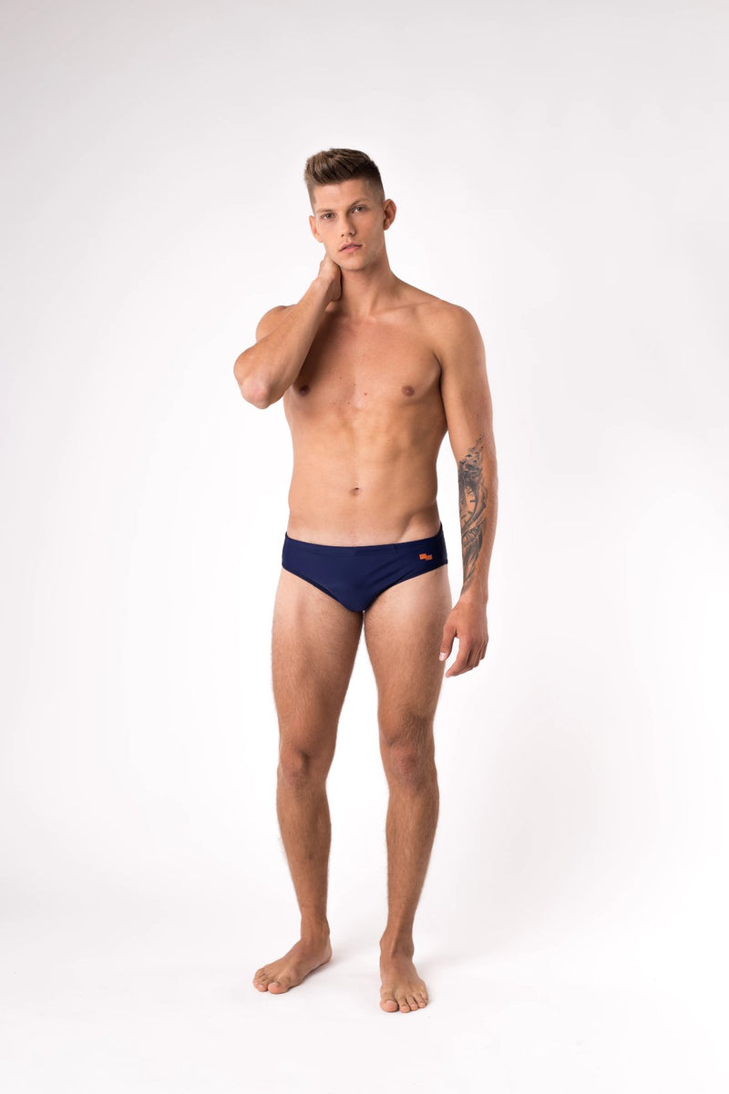 Tall man modelling navy blue swim brief - Copper Bottom Swim